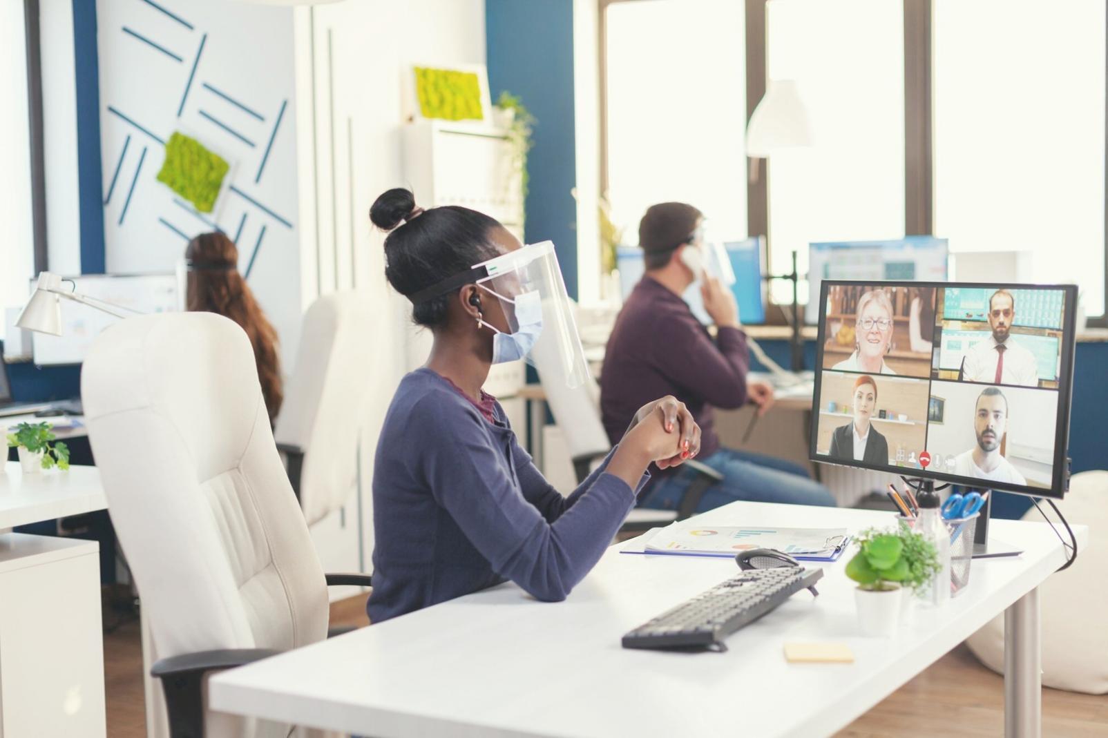Person working on emergency fund budget plan with laptop