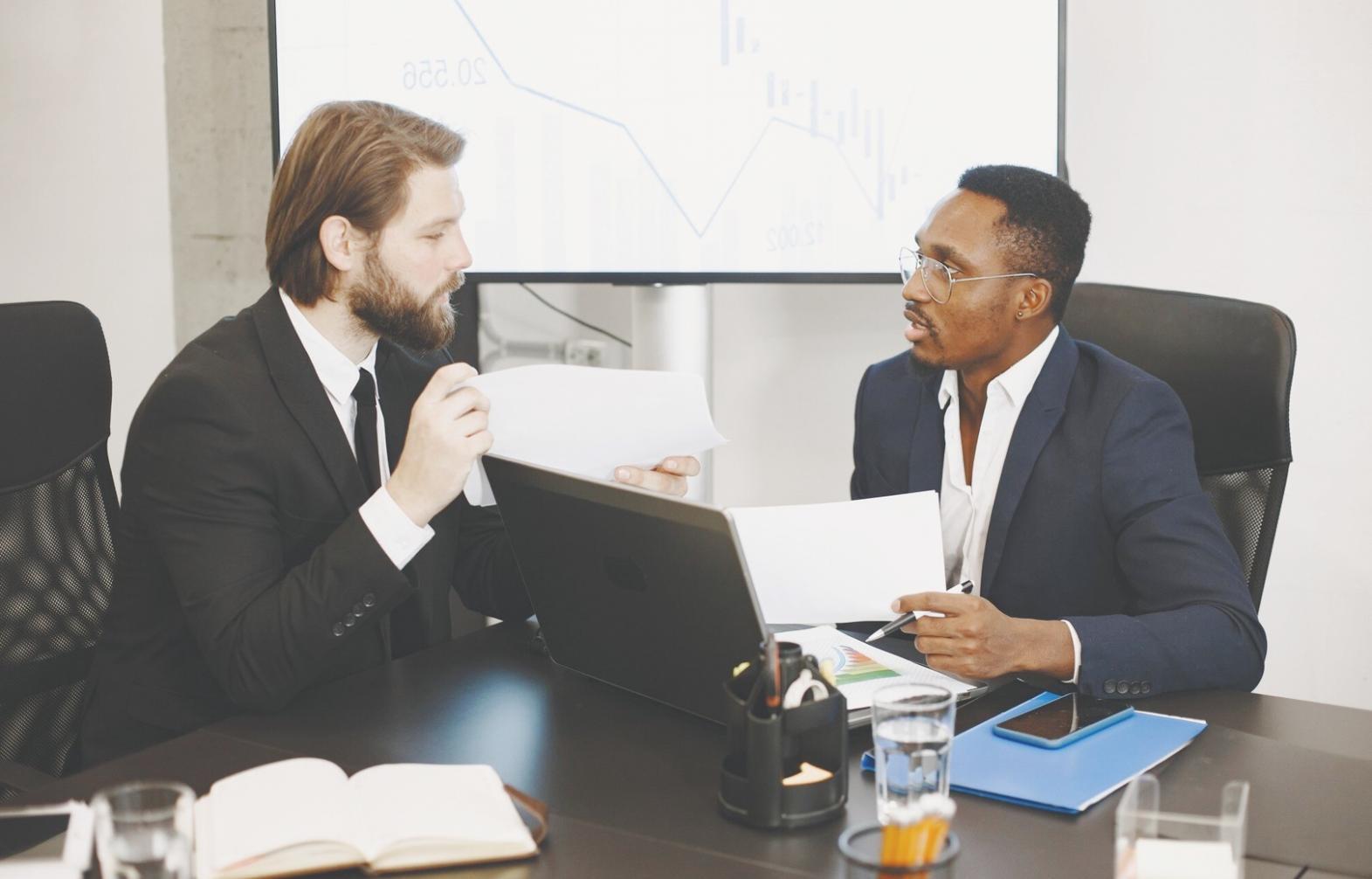 Calculator, financial documents and planning materials on desk